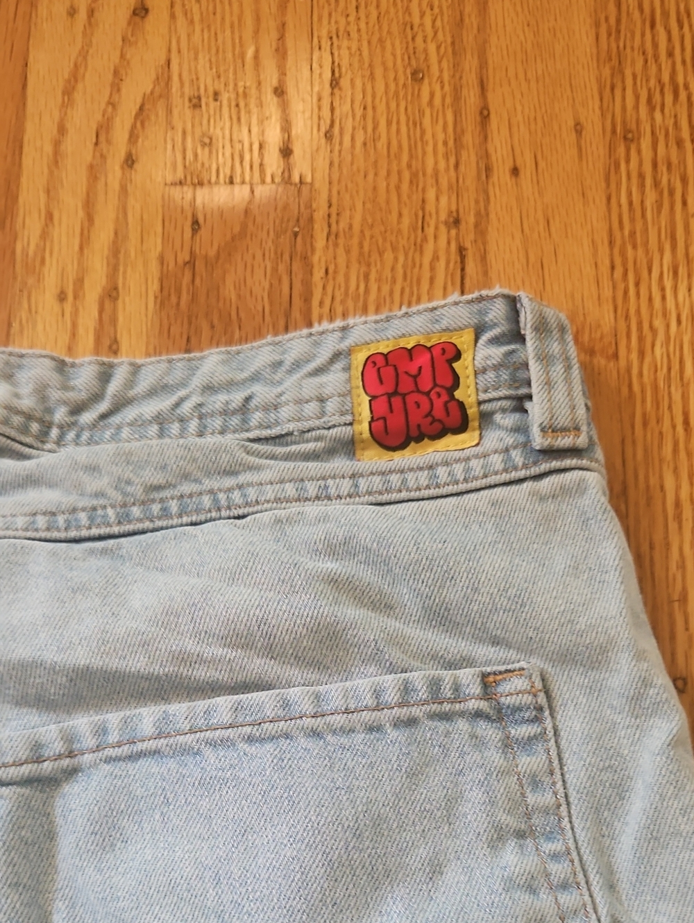 Zumiez Light Blue Relaxed Denim Jeans with Yellow Logo Patch